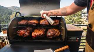 Win a Traeger Pro 575 Grill | Grilling meat on a Traeger